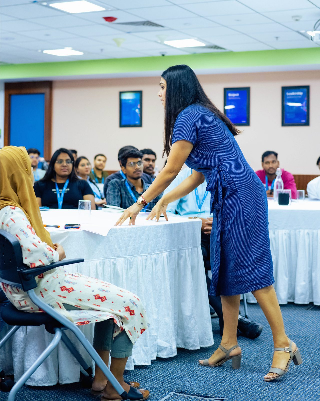 Engaging with participants at a corporate workshop