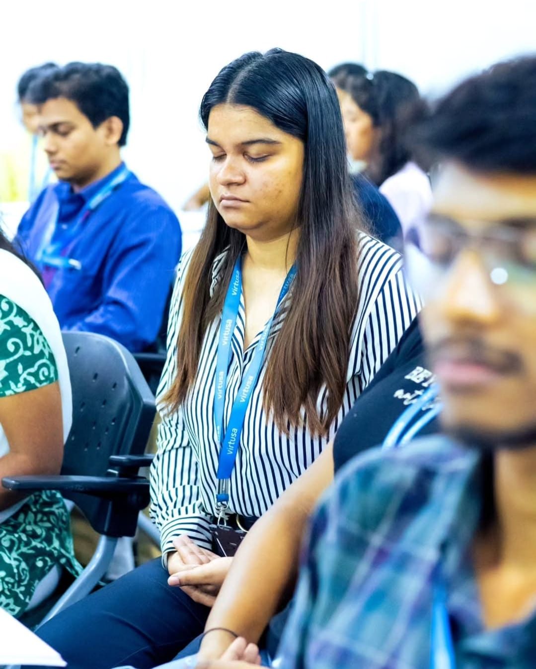 Participants with eyes closed during a guided meditation