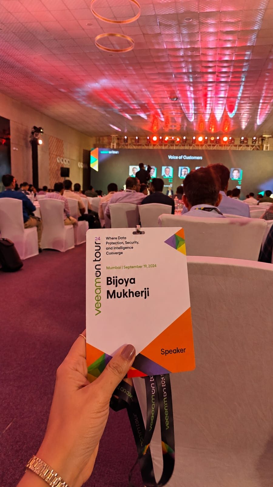 Speaker badge for Bijoya Mukherji at a conference venue