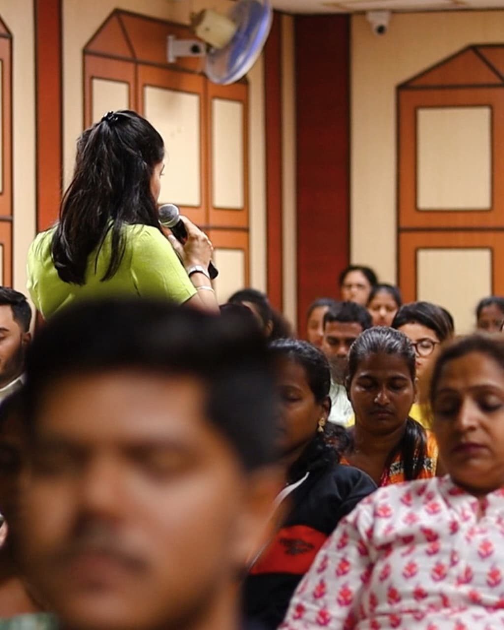 Addressing an audience with a microphone