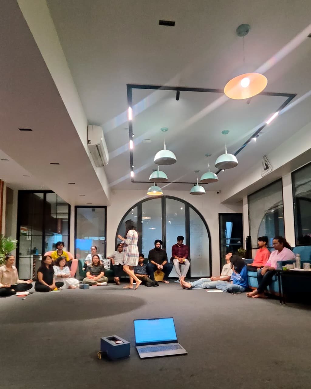 Circle session with participants seated on the floor
